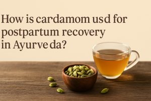 How is cardamom used for postpartum recovery in Ayurveda?